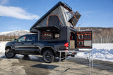 Experience overlanding with this Tacoma truck camper and rooftop tent, perfect for your next RV rental adventure.