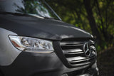 Close-up of a Mercedes-Benz Sprinter van with textured hood, ideal for your next rv rental adventure.