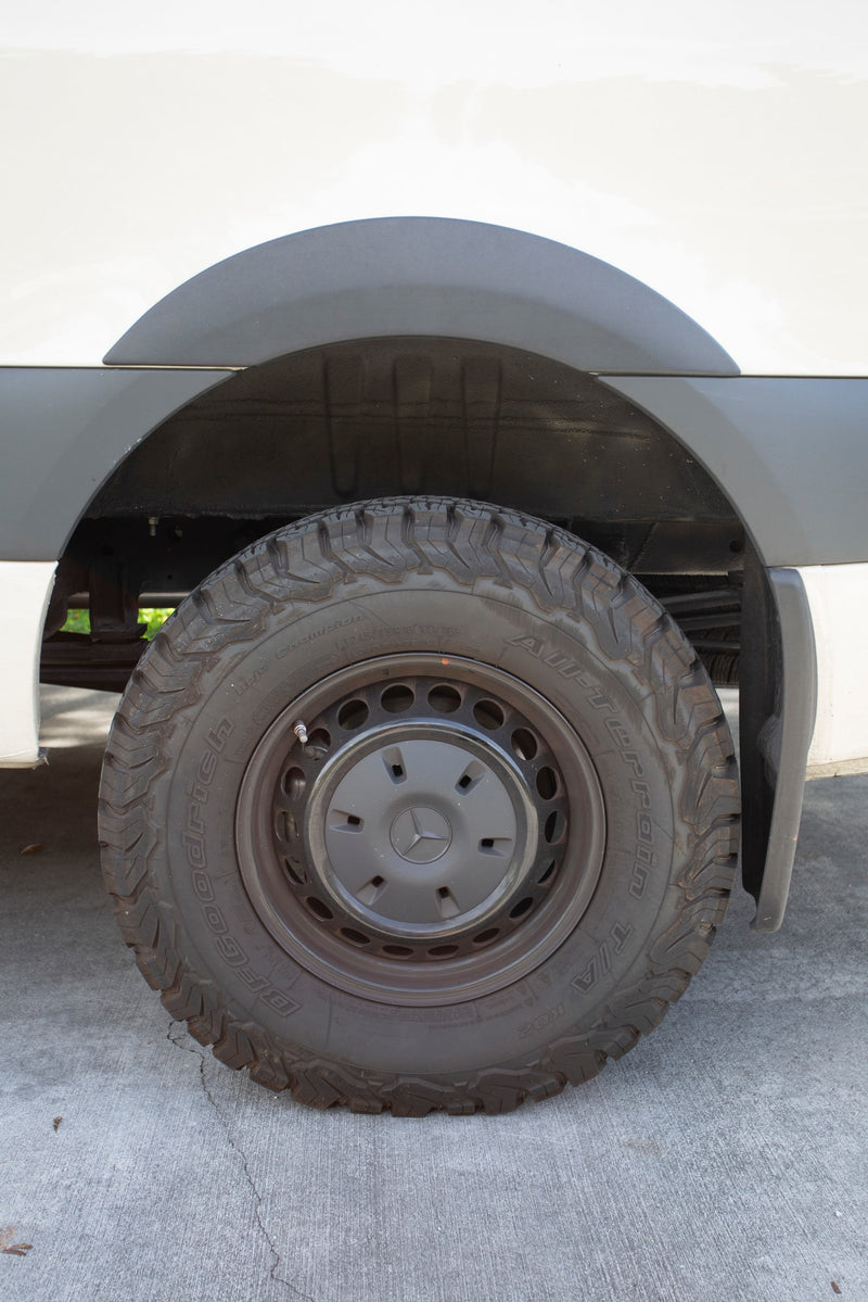 Close-up of an RV rental's rugged BFGoodrich All-Terrain tire and black wheel, ready for your next road trip adventure. — photo 16