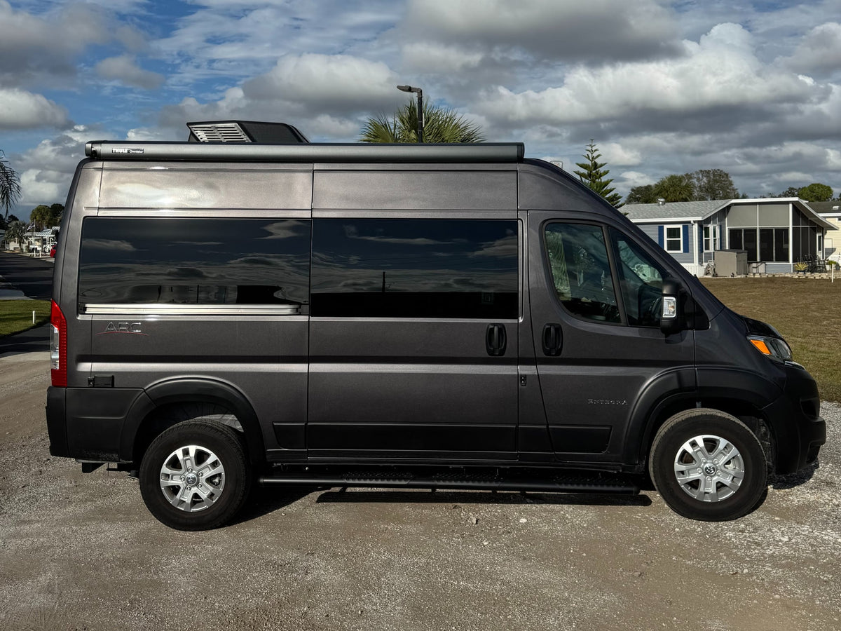Dark gray Entegra camper van (Class B RV) with a Thule awning — photo 1