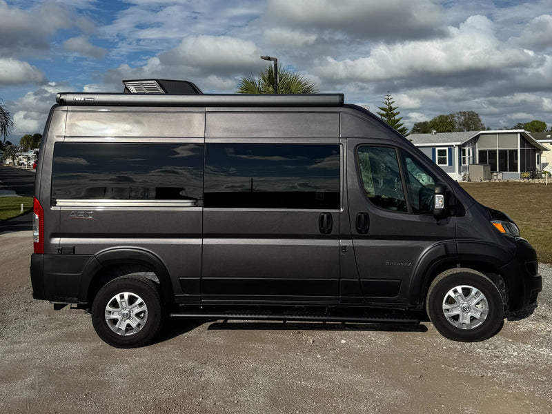 Dark gray Entegra camper van (Class B RV) with a Thule awning — photo 1