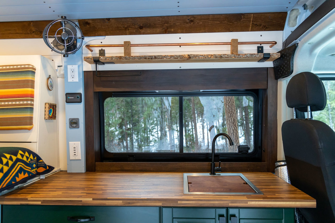  featuring National Park mugs. Ready for your van life adventure!|This vibrant rv rental camper van interior features a bunk bed — photo 10