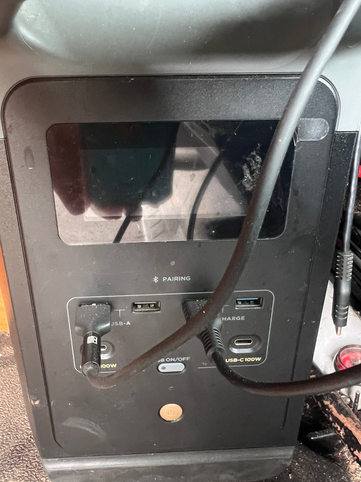 Portable power station for RV rental, showing USB-A, USB-C 100W ports, USB on/off, and Bluetooth pairing.