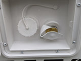 RV rental water fill and city water hookup. White compartment showing non-pressure water cap and brass hose inlet for an RV.