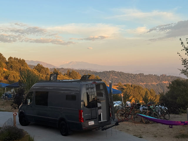 Scenic RV rental campsite with a camper van