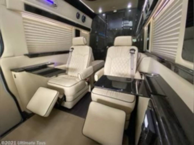  and elegant ambient lighting.|Plush RV rental interior featuring a stylish ceiling with large — photo 5