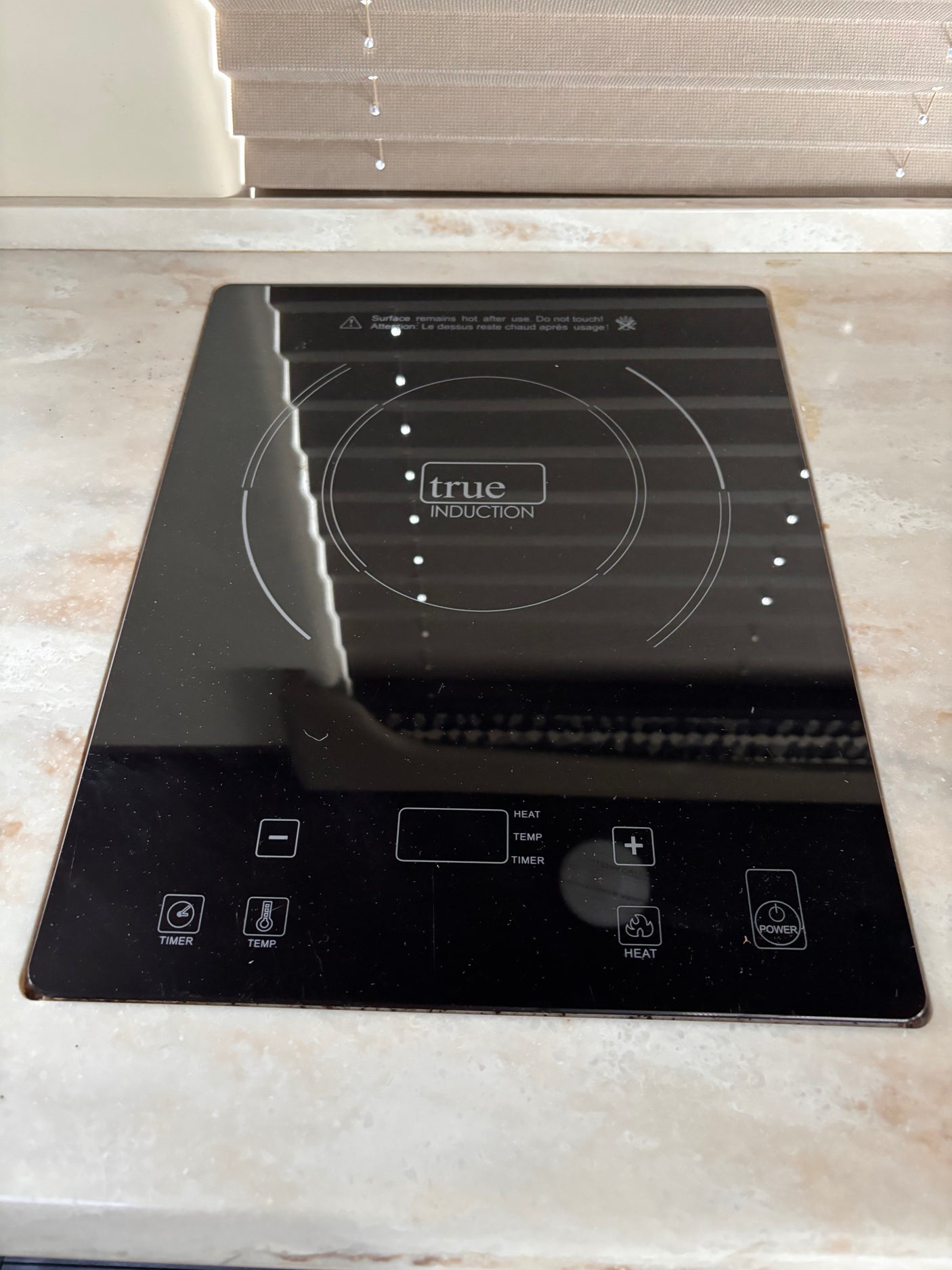 Modern True Induction cooktop, ideal for an RV rental kitchen, featuring sleek touch controls for versatile cooking.