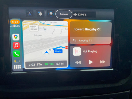 CarPlay screen in an RV rental, showing navigation to Ringsby Ct (7:02 ETA, 10 min, 5.7 mi) with music controls.