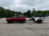 Patriot X3 trailer side profile in daylight, tent packed down for towing