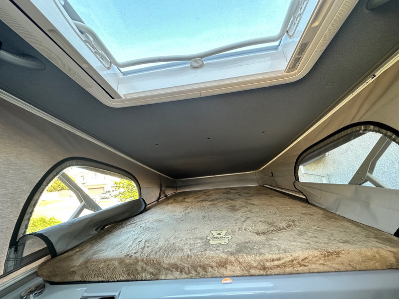  showing efficient use of space.|Rear doors of an RV rental are open — photo 9