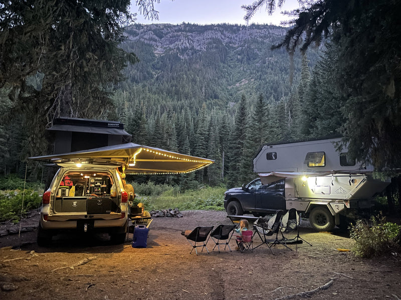 Rooftop tent and awning setup at a campsite at dusk — photo 8