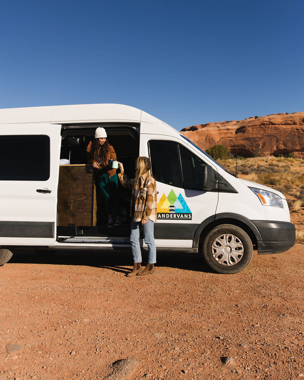  and blue bags.|This RV rental features a compact kitchen with a sink