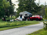 Evening campsite scene with the trailer set up