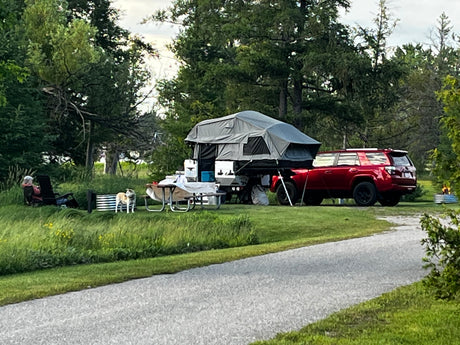 Evening campsite scene with the trailer set up
