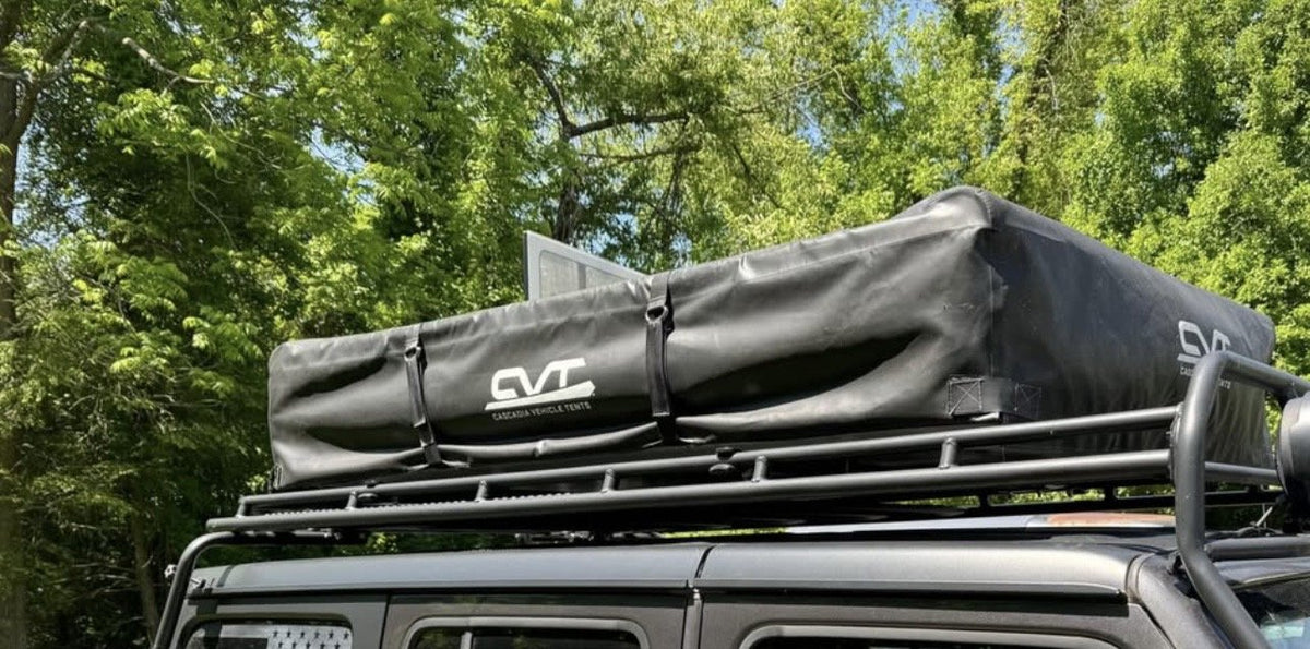 Tent closed in its black CVT travel cover, mounted on the vehicle roof rack — photo 4