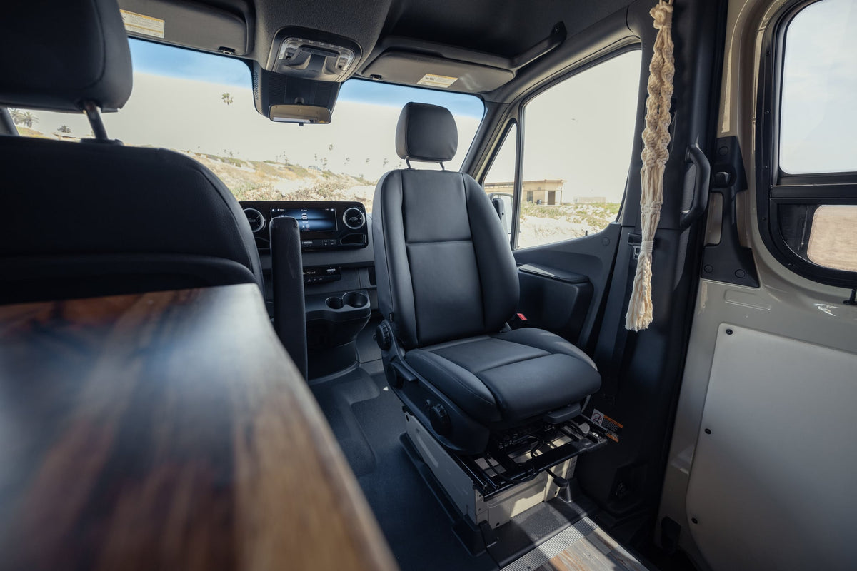  custom interior with seating and storage.|Tan Mercedes Sprinter 4x4 camper van rv rental — photo 9