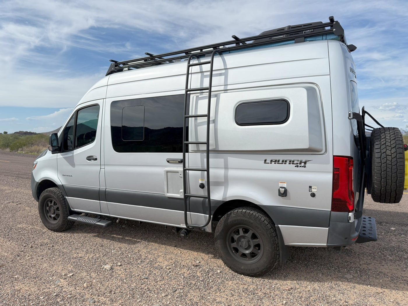  and framed by impressive rock formations.|This RV rental camper van is set up at campsite 71 — photo 6