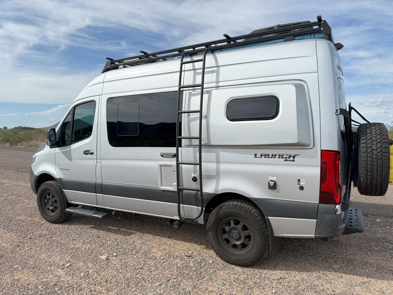 and framed by impressive rock formations.|This RV rental camper van is set up at campsite 71 — photo 6