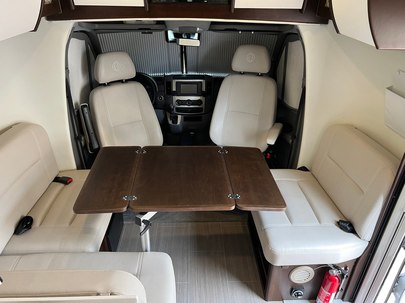  and a rear kitchenette.|Front cabin of a clean Mercedes-Benz Sprinter RV rental — photo 14