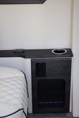 RV rental convenience: This modern interior features a quilted seat, USB/AC charging, cupholder, and mesh storage.