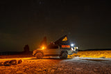 Explore the stars! This equipped overlanding truck with a rooftop tent is an ideal adventure rv rental for remote camping.