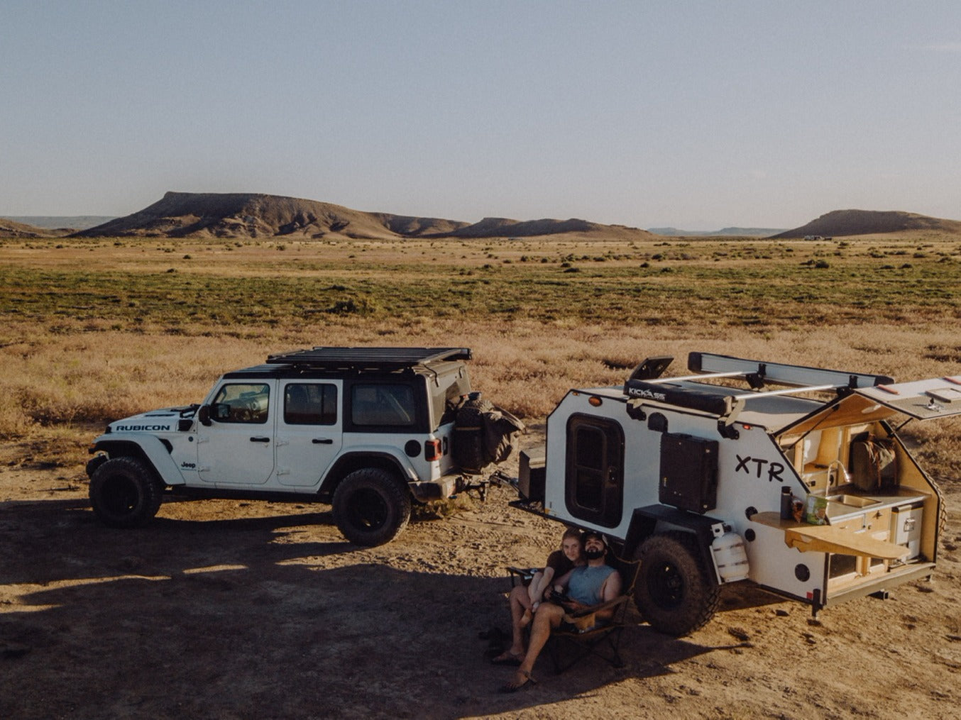 Adventure awaits! This off-road Jeep & XTR camper setup offers remote RV rental exploration for a couple.