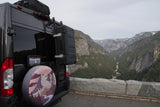 RV rental camper van with gear overlooks Yosemite Valley. Stunning mountain views, river, and waterfall for #vanlife travel.