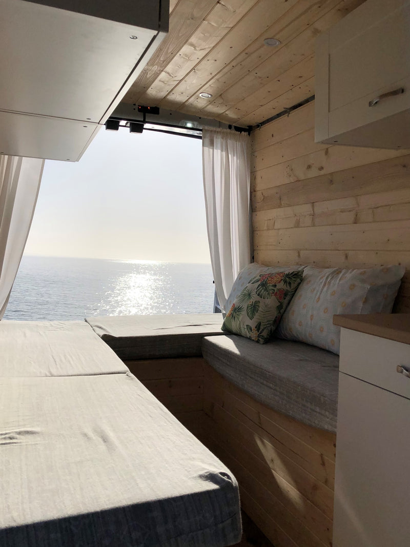  enjoyed with coffee from your comfortable bed.|Enjoying the stunning ocean view from an RV rental! Legs stretched out on the bed — photo 12