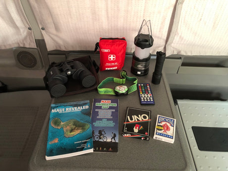 RV rental ready: Maui guides, map, first aid kit, headlamp, lantern, binoculars, and games for camping fun.