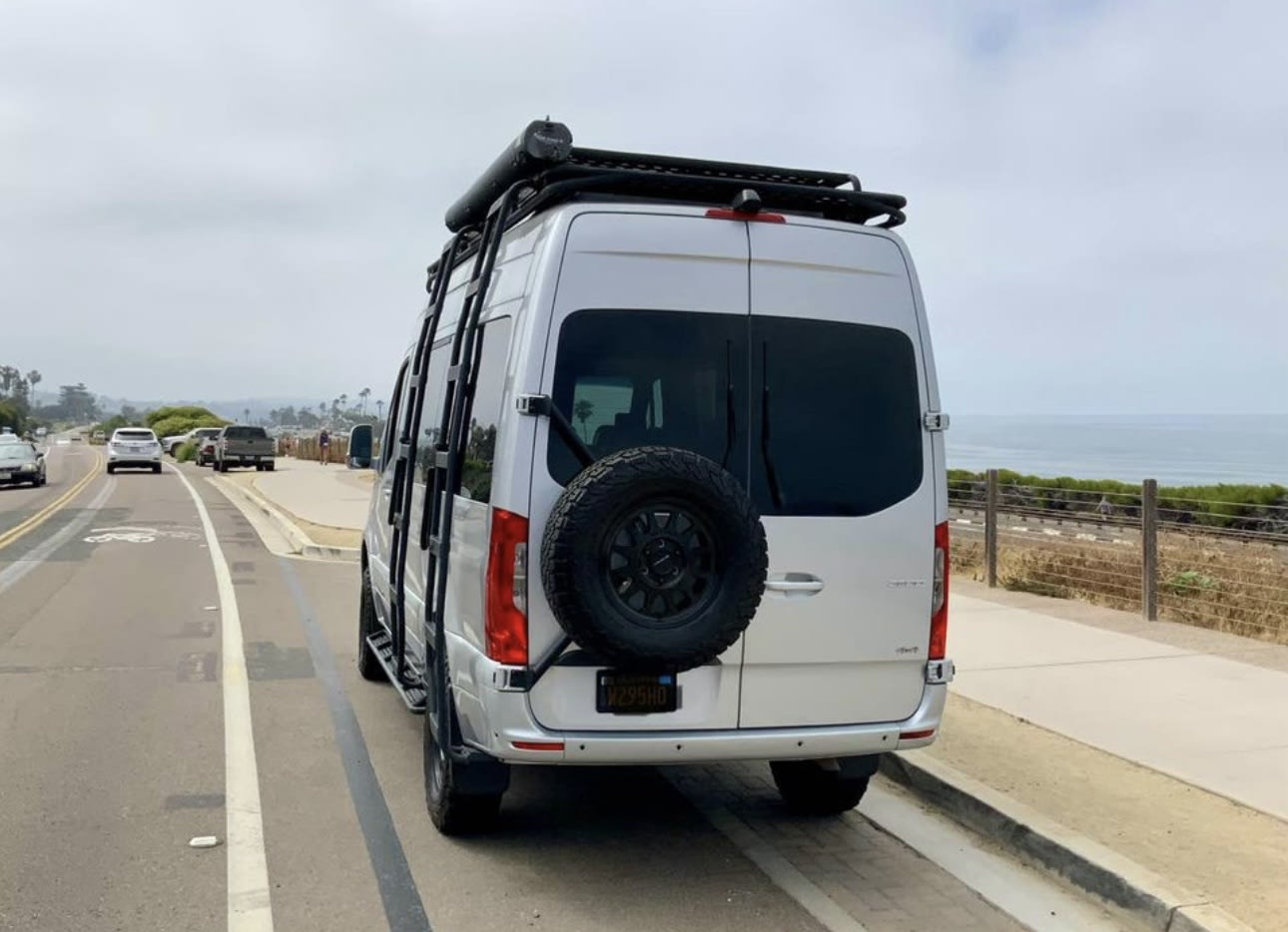  ready for your next RV rental journey.|Silver Mercedes-Benz Sprinter rv rental van with roof & bumper lights — photo 2