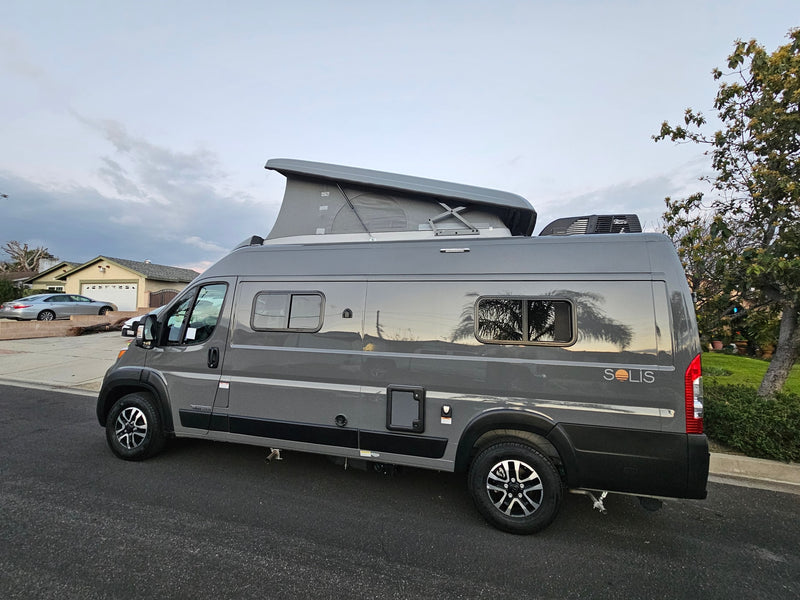 Modern gray Winnebago Solis pop-top RV rental parked curbside, ideal for road trips and camping adventures. — photo 6