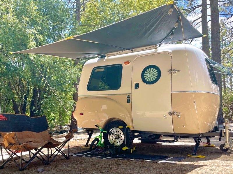  is parked by a rocky desert road. Ideal for scenic travel & camping.|Experience adventure with this Happier Camper rv rental! A retro trailer towed by a white Subaru on a scenic — photo 7