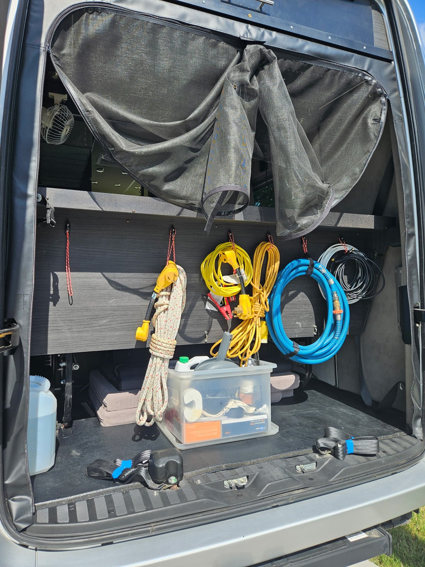 and a stainless steel spice rack. Bright windows illuminate the compact galley.|RV rental Dometic climate control set to cool at 68°F in auto mode