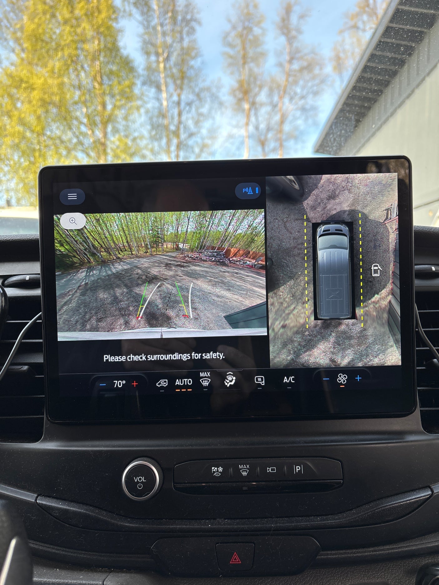 Inside an RV rental, a large touchscreen infotainment display shows 360 camera views for parking assist, with climate controls visible.