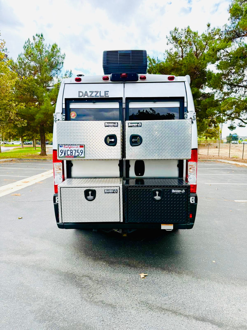  revealing a peek at the cozy interior.|Light gray Dazzle RV rental with its pop-top open — photo 3
