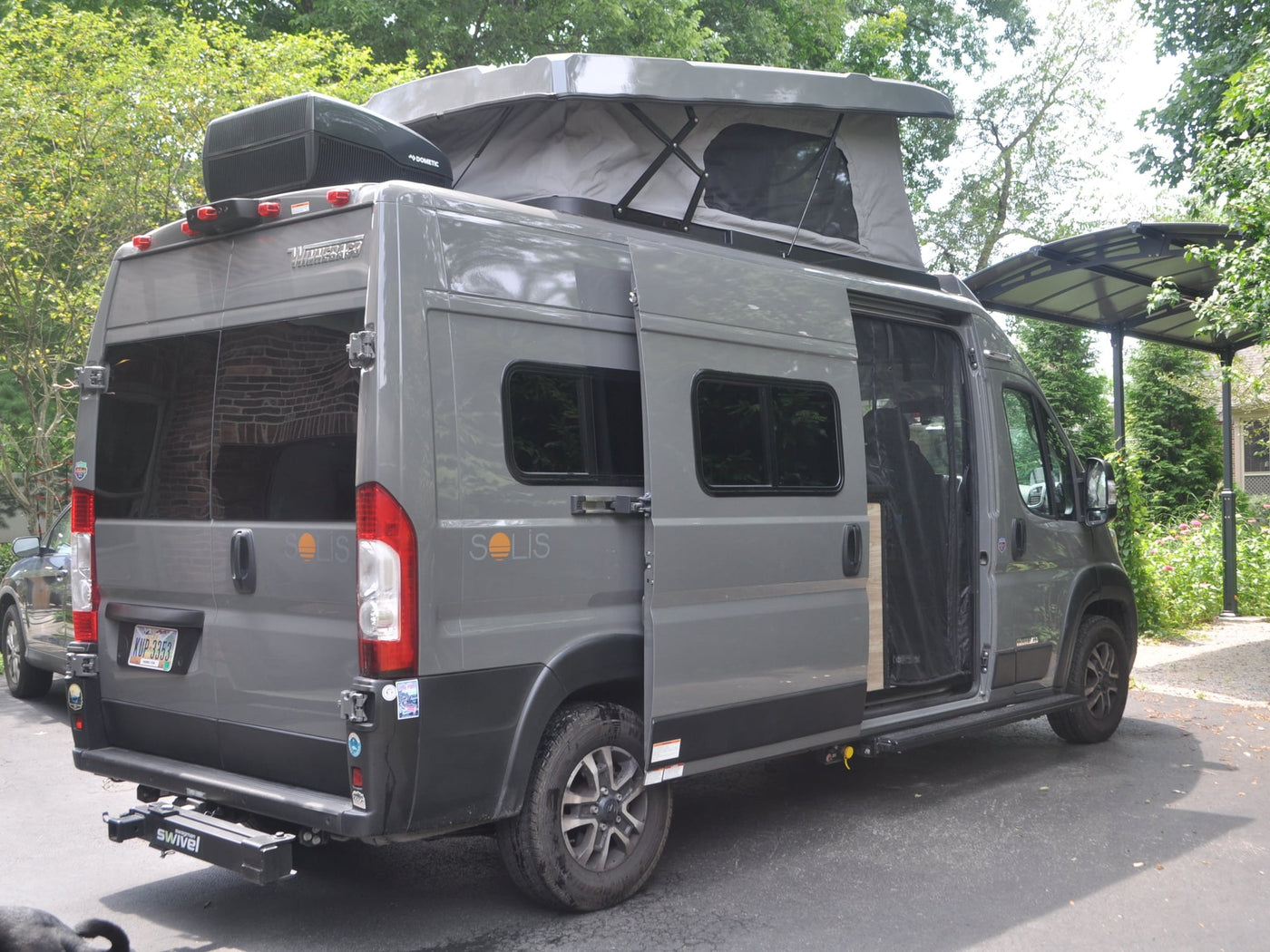 This gray Winnebago Solis rv rental van — photo 1