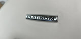 Luxurious 'PLATINUM' emblem on a light, textured interior surface, suggesting a premium rv rental experience.
