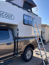 Scout truck camper RV rental with rooftop tent and ladder on a pickup. Perfect for your next adventure.