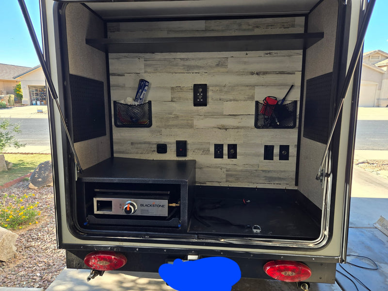  ready for travel.|Sunlit RV rental interior: a comfortable black futon bed — photo 9
