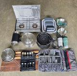 Equip your rv rental for outdoor cooking! This setup includes a camp stove, pots, pans, dishes, spices, and utensils.
