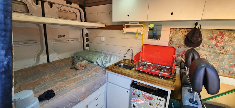  and storage.|RV rental: Inside a converted camper van — photo 13