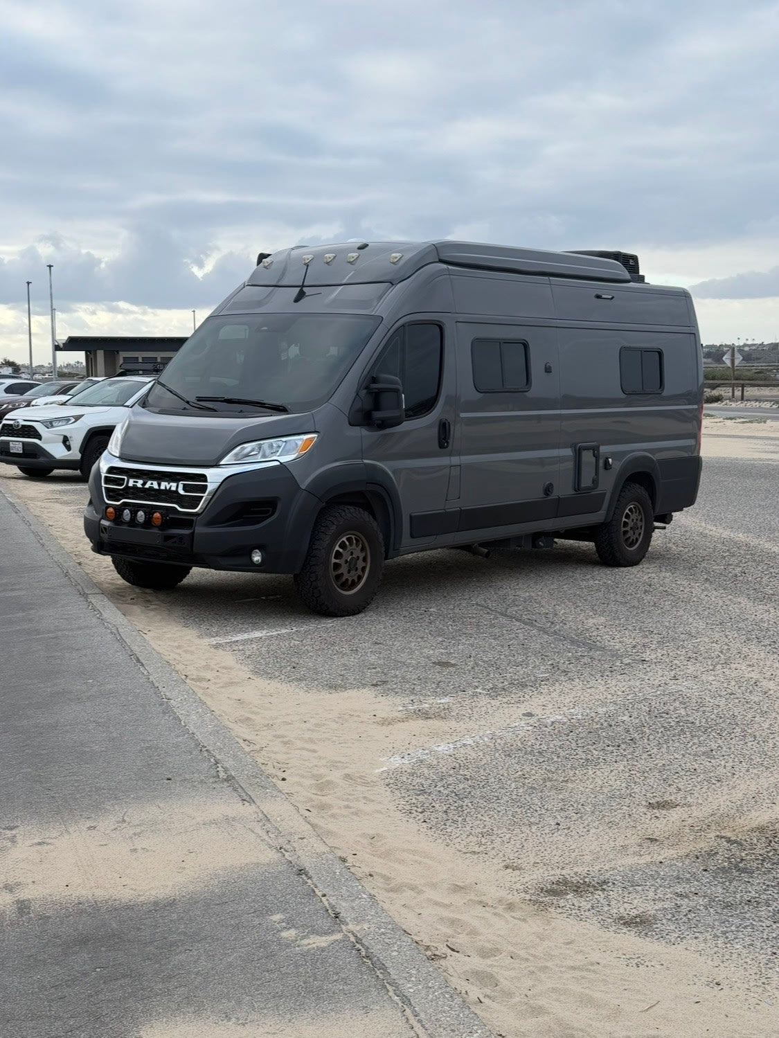  is parked on sand beside a road — photo 5