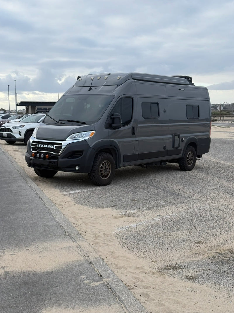  is parked on sand beside a road — photo 5