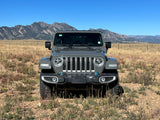 Rugged grey Jeep Wrangler in a dry mountain field. Your adventure vehicle, perfect for any rv rental trip.
