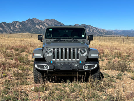 Rugged grey Jeep Wrangler in a dry mountain field. Your adventure vehicle, perfect for any rv rental trip.
