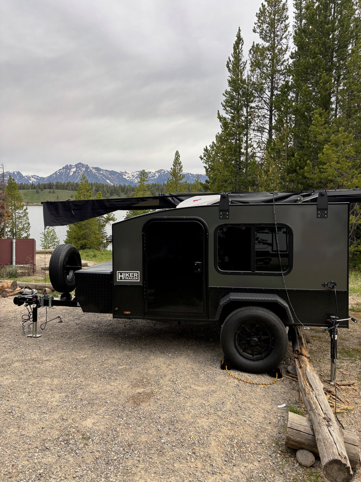 Hiker Trailer teardrop RV rental at a scenic mountain-lake campsite — photo 1