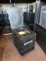 Portable BOXIO compost toilet inside an RV rental, showing its use for convenient off-grid travel.