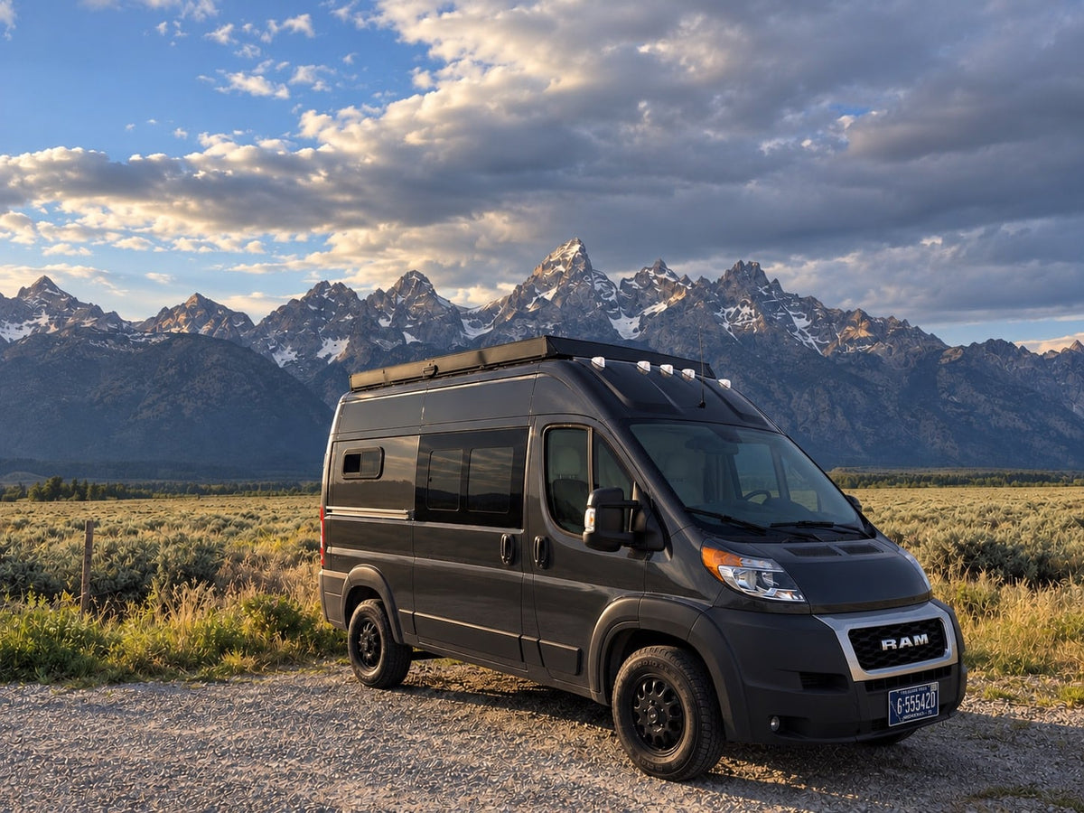  overlooking scenic mountains. Driver's area visible.|Inside this rv rental — photo 6
