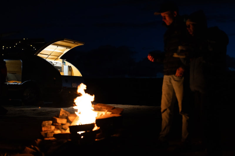  and gear for outdoor adventures.|An RV rental dream: a Tacoma with a rooftop tent and a teardrop trailer illuminate a desert campsite at dusk. Perfect for adventure.|This RV rental — photo 17