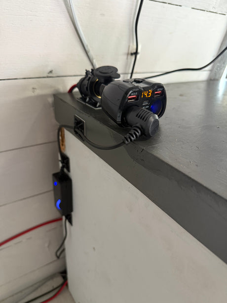 RV rental mobile power hub: Multi-port USB charger, 12V socket, and 14.3V display, for convenient on-the-go charging.